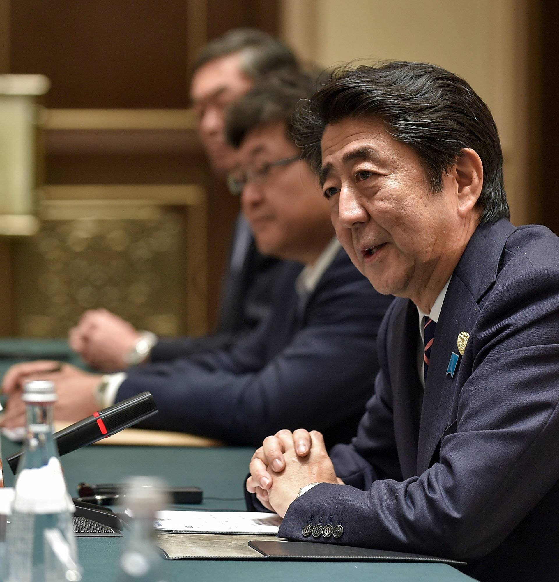 Japanese Prime Minister Abe speaks during his meeting with Chinese President Xi at the West Lake State House on the sidelines of the G20 Summit, in Hangzhou