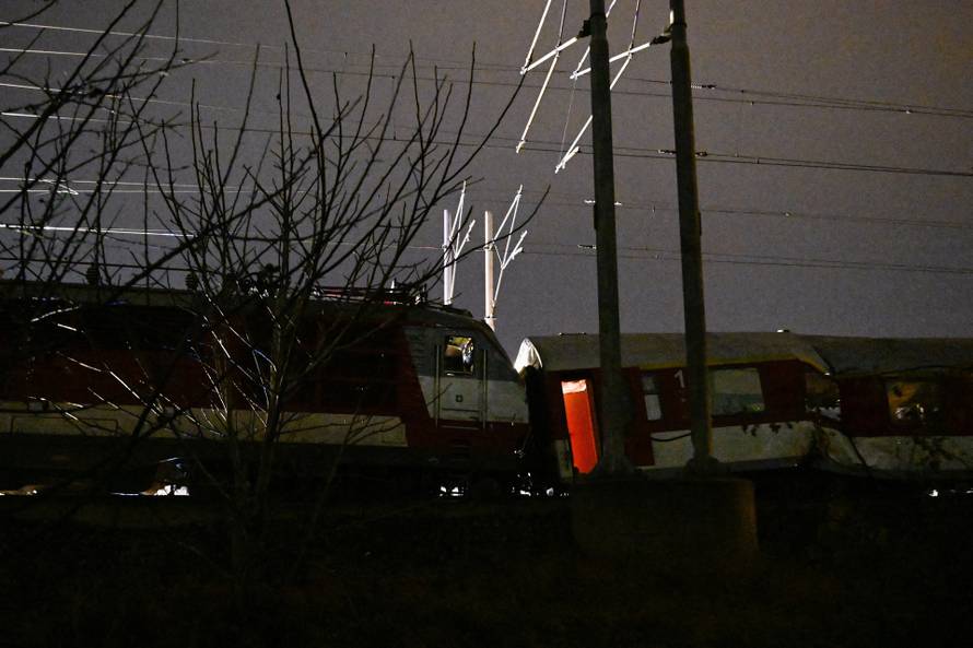 First responders attend the scene of a collision between two trains in the town of Pezinok