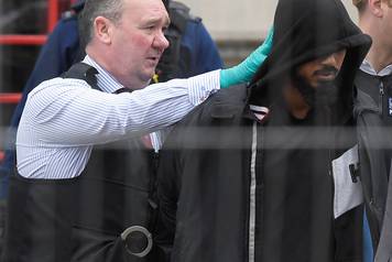 A man is led away by police in Westminster after an arrest was made on Whitehall in central London