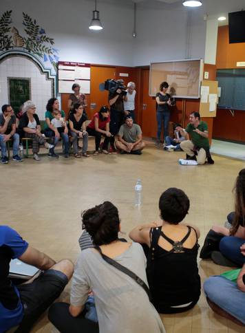 People gather in the Miquel Tarradell high school, one of the designated polling stations, to occupy the premises in a bid to permit voting in the banned independence referendum in Barcelona