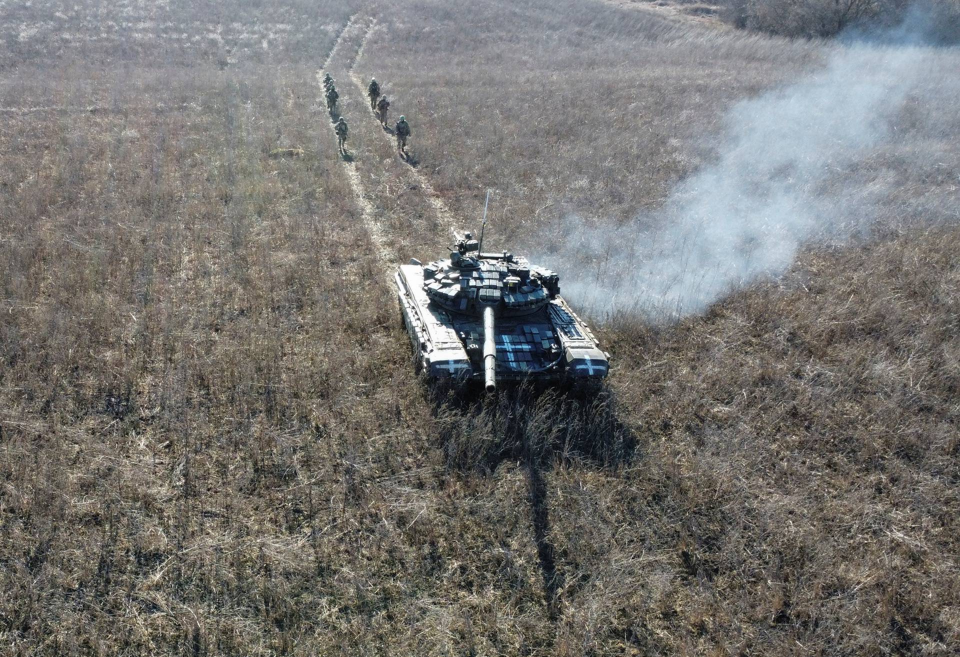 Ukrainian servicemen take part in tank military drills in Kharkiv region