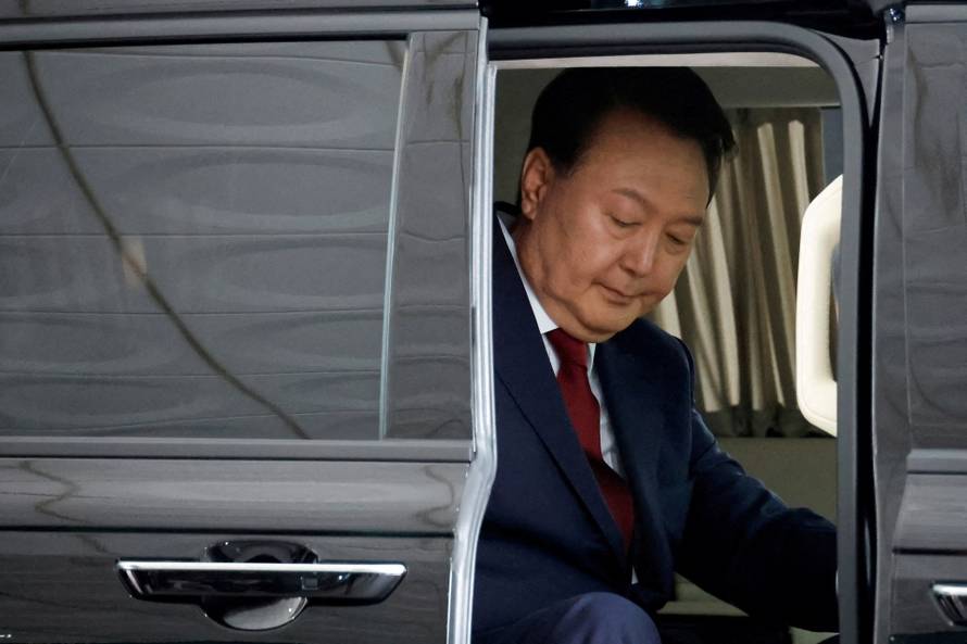FILE PHOTO: South Korea's Yoon appears for questioning over special prosecutor's probe into martial law