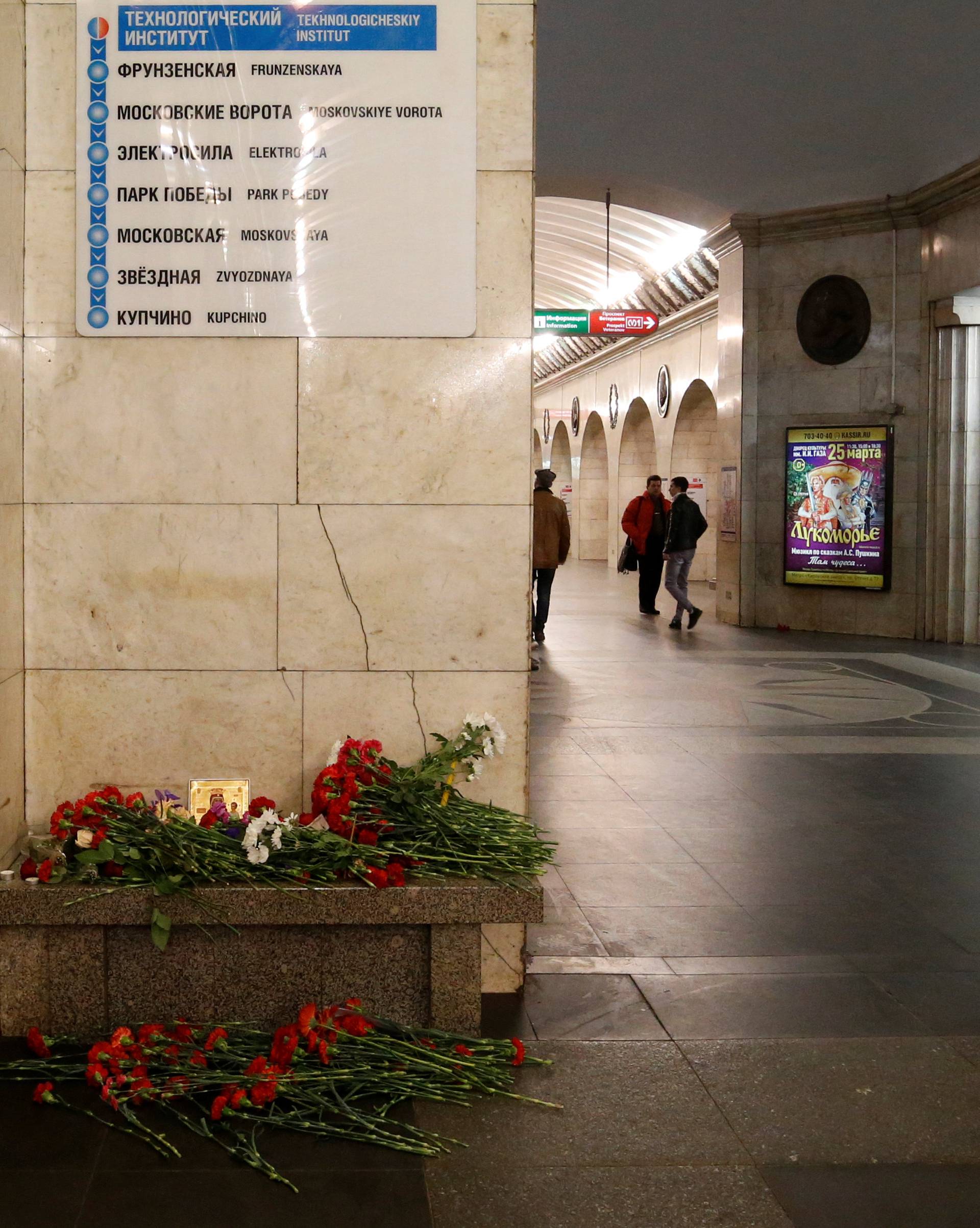 A man reacts next to a memorial site for the victims of a blast in St. Petersburg metro, at Tekhnologicheskiy institut metro station in St. Petersburg