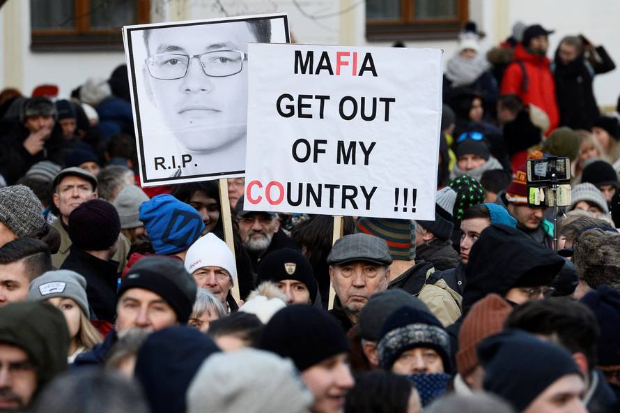 Participants march in honor of murdered Slovak investigative reporter Jan Kuciak in Bratislava