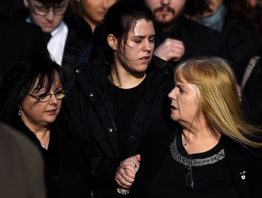 Eillen O'Riordan leaves her daughter Dolores O'Riordan's funeral with one of Dolores' daughters and Dolores' sister Angela at St Ailbe's Church in Ballybricken