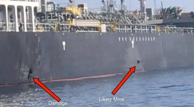 A picture released by U.S. Central Command shows damage from an explosion (L) and a likely limpet mine, on the hull of the civilian vessel M/V Kokuka Courageous in the Gulf of Oman