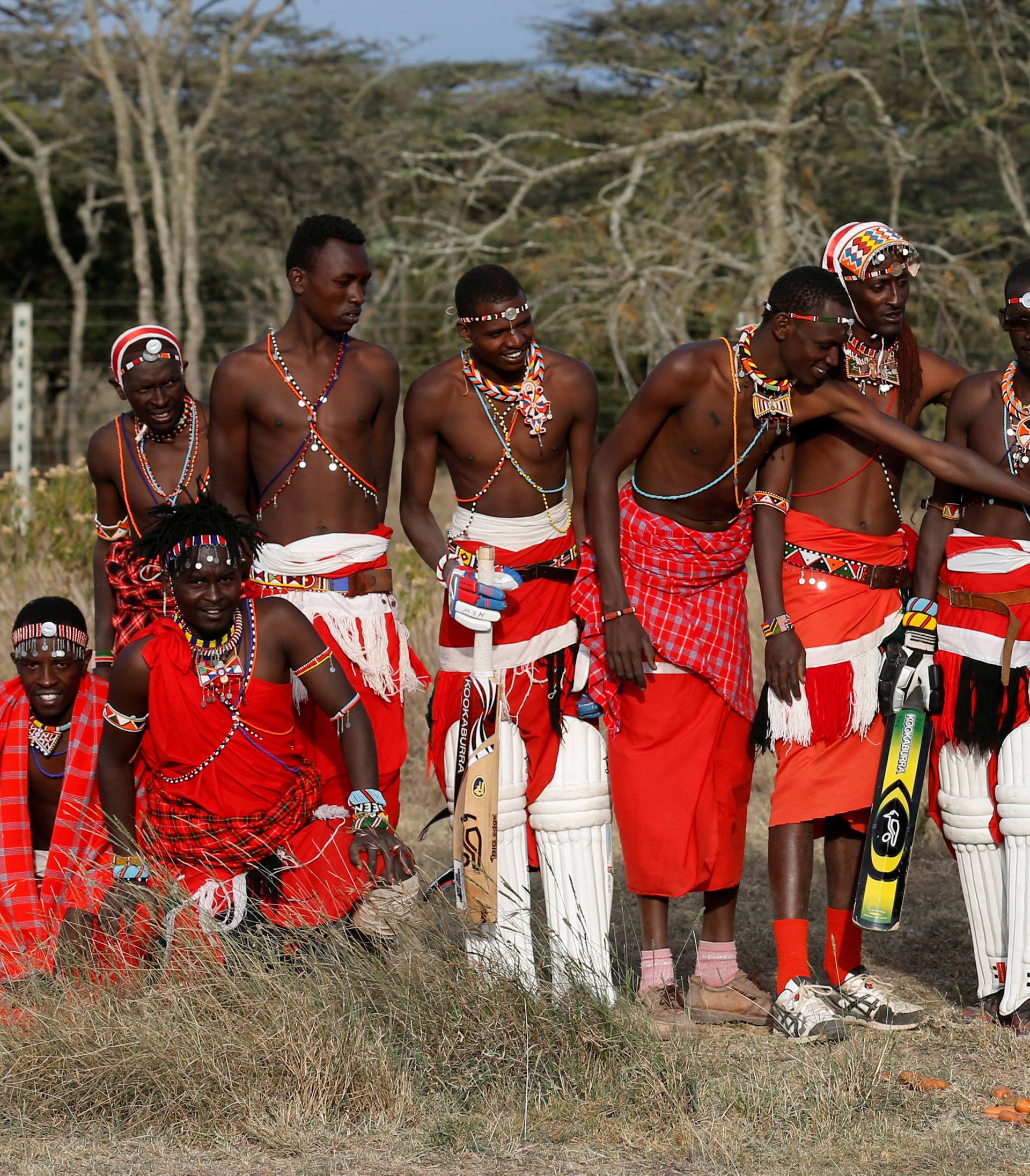 FILE PHOTO: Members of the Maasai Cricket Warriors pose for a photograph with the last surviving male northern white rhino in Laikipia