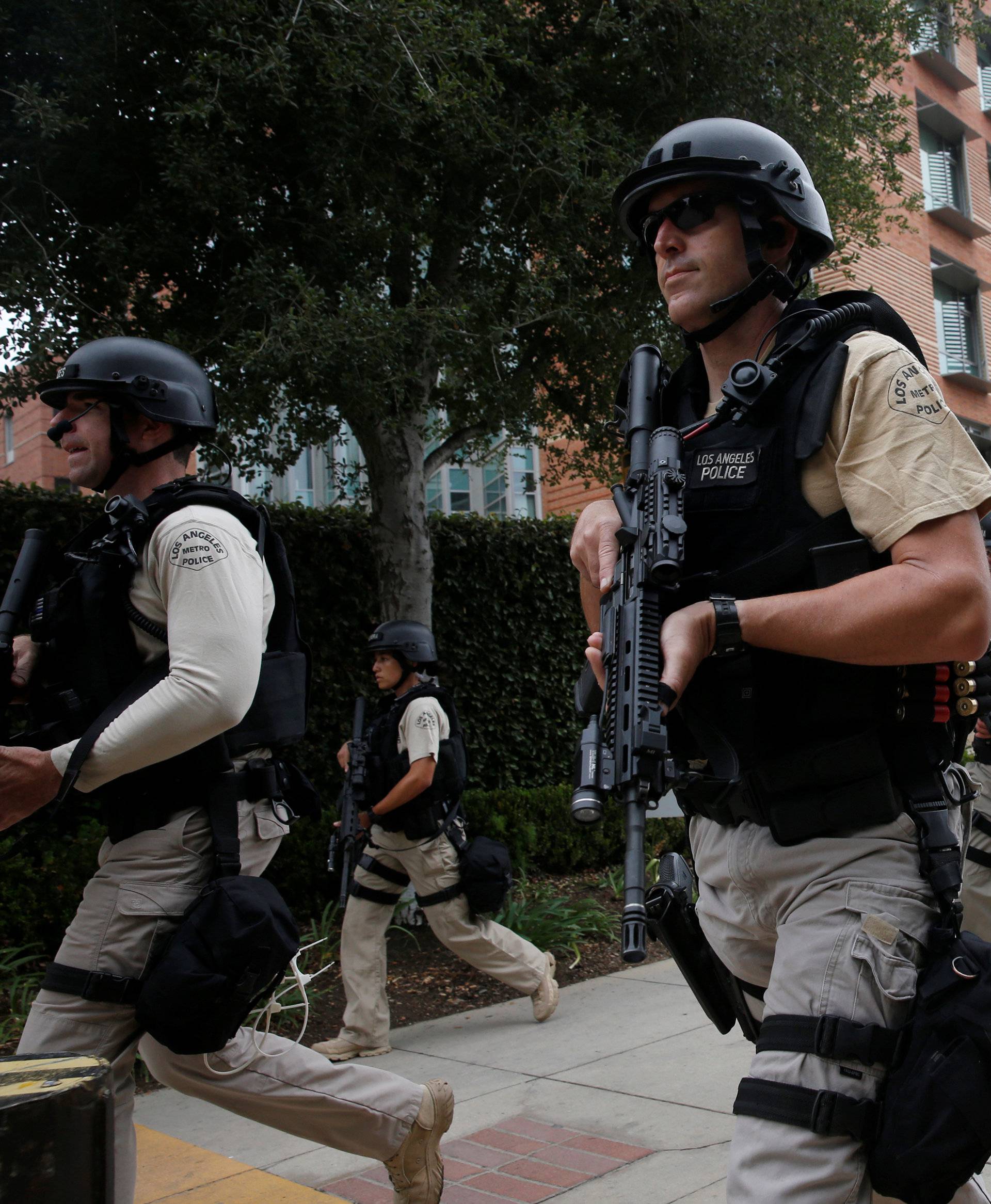 A Los Angeles Metro Police squad conducts a search on the University of California, Los Angeles campus after it was placed on lockdown following reports of a shooter on the campus in Los Angeles