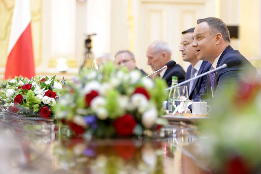 Polish President Andrzej Duda and U.S. President Donald Trump (not in picture) attend a meeting in Warsaw