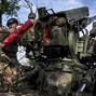 Ukrainian servicemen fire a self-propelled howitzer toward Russian positions on a frontline in Zaporizhzhia region