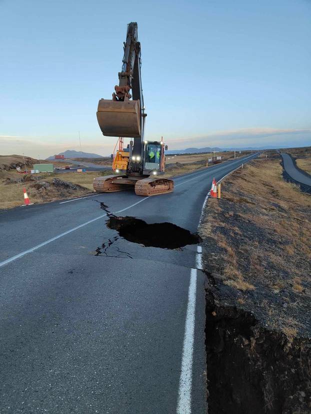 Streetwork is going on after cracks emerged on a road due to volcanic activity near Grindavik