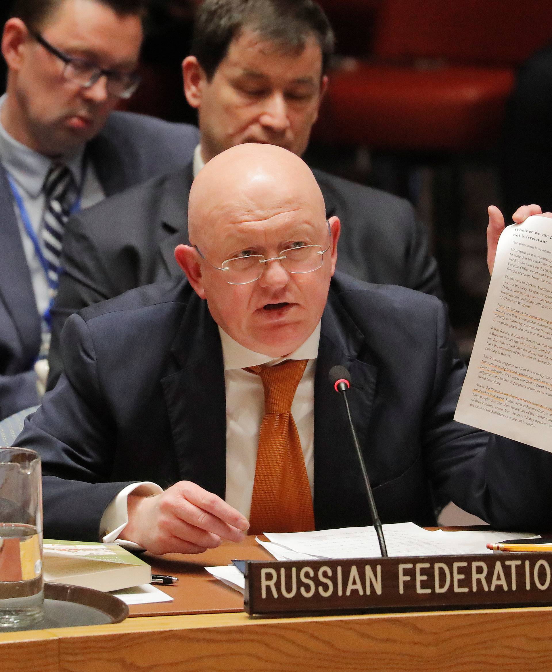 Russian Ambassador to the U.N. Vasily Nebenzya holds a paper up as he speaks regarding an incident in Salisbury, during a meeting of the U.N. Security Council at U.N. headquarters in New York