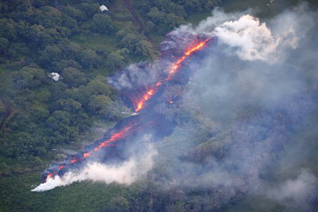 Lava erupts from a fissure east of the Leilani Estates subdivision during ongoing eruptions of the Kilauea Volcano