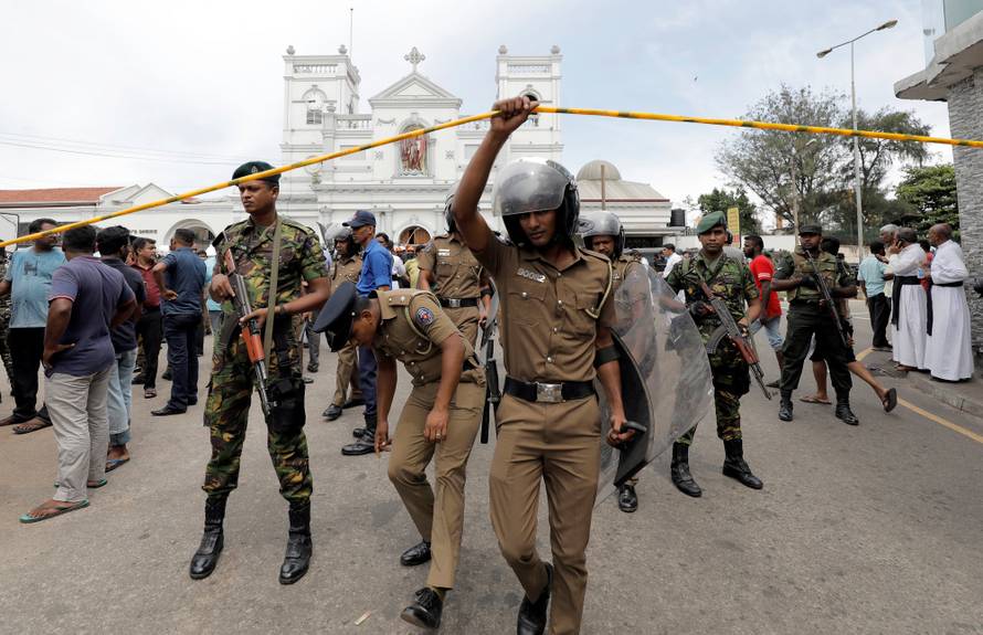 Sri Lankan military officials stand guard in front of the St. Anthony's Shrine, Kochchikade church after an explosion in Colombo