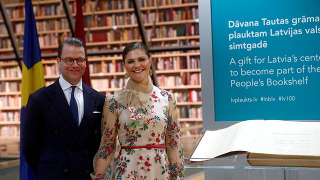 Sweden's Crown Princess Victoria and Prince Daniel attend a book presentation at the People's Bookshelf at Latvia's National Library in Riga