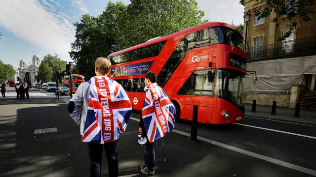Vote leave supporters stand outside Downing Street in London