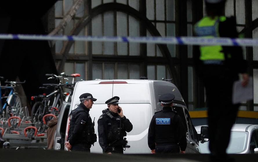 Police officers secure a cordoned off area at Waterloo station near to where a suspicious package was found, in London
