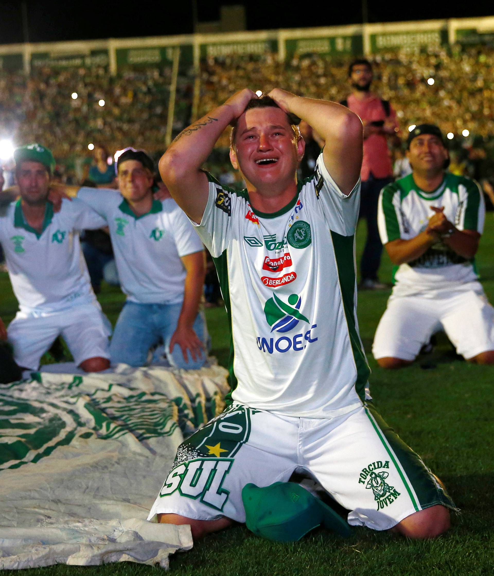 Fans of Chapecoense soccer team pay tribute to Chapecoense's players at the Arena Conda stadium in Chapeco