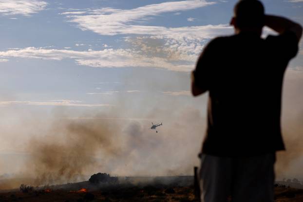 A wildfire burns on the outskirts of Valmojado