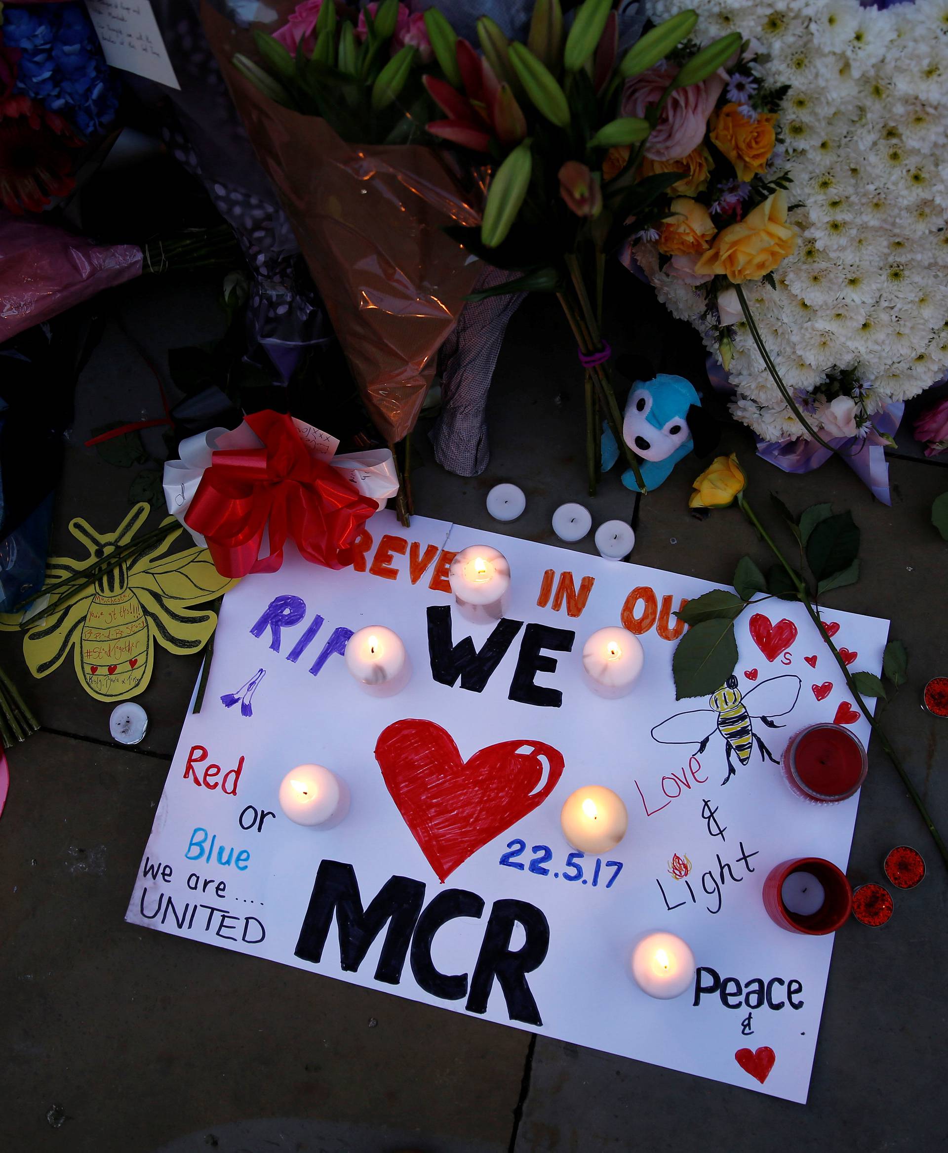 Flowers and messages are left for the victims of the Manchester Arena attack in central Manchester