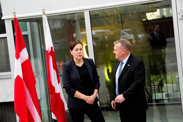 Denmark's Foreign Minister Lars Loekke Rasmussen and Greenland's Foreign Minister Vivian Motzfeldt prepare for meeting at the White House