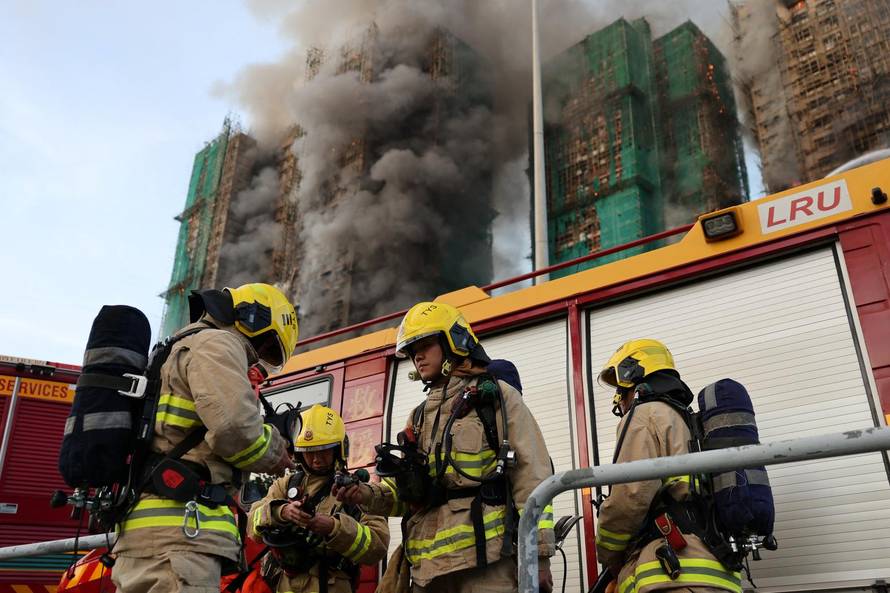 Flames engulf bamboo scaffolding across multiple buildings at Wang Fuk Court housing estate, in Tai Po
