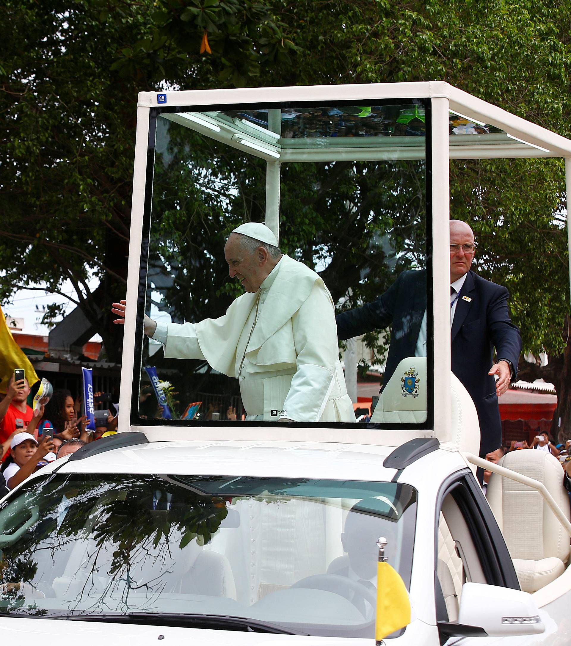 Pope Francis greets people in a neighbourhood in Cartagena