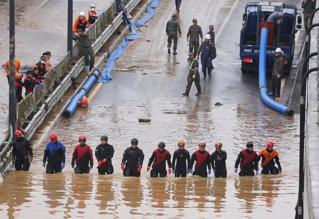 Search and rescue operation at an underpass that has been submerged by a flooded river caused by torrential rain in Cheongju