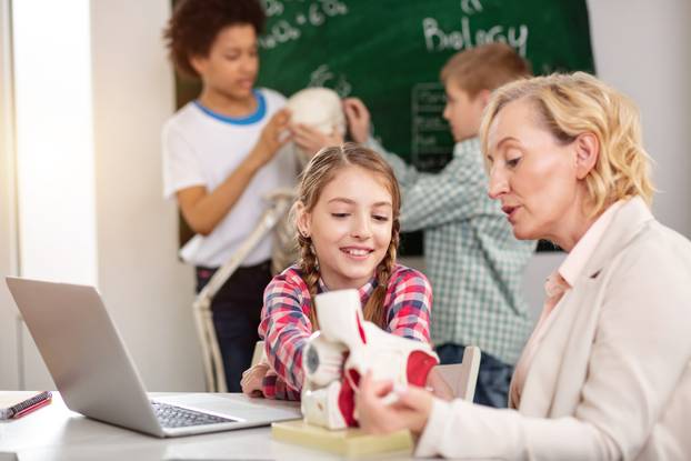 Serious smart woman explaining the material