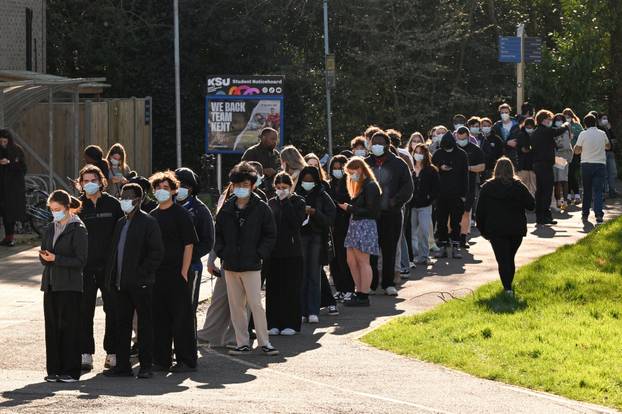People queue to receive vaccinations at the Sports centre on the University of Kent campus, following an outbreak of meningitis cases in Kent