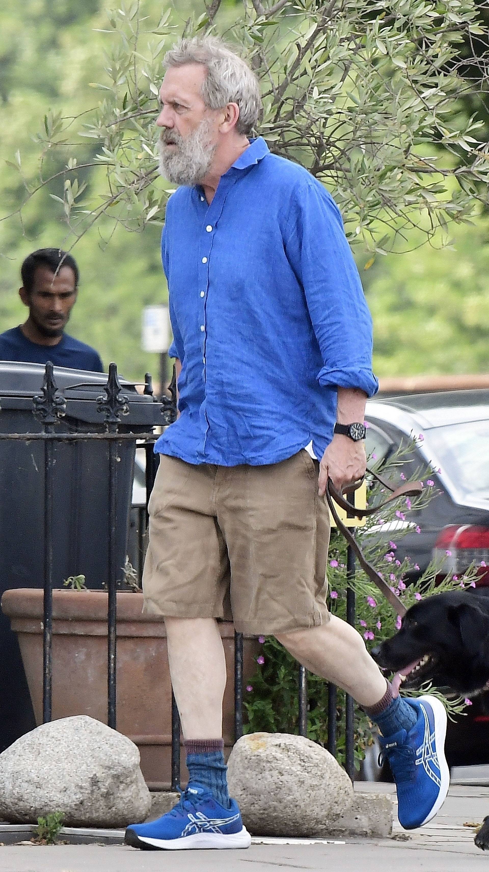 *EXCLUSIVE* STRICTLY NOT AVAILABLE FOR ONLINE USAGE UNTIL 22:00 PM UK TIME ON 02/08/2022 - WEB MUST CALL FOR PRICING  - 

The English Actor Hugh Laurie cuts a rather dishevelled look during his jaunt out walking the dog in North London.
*PICTURES TAEKN ON