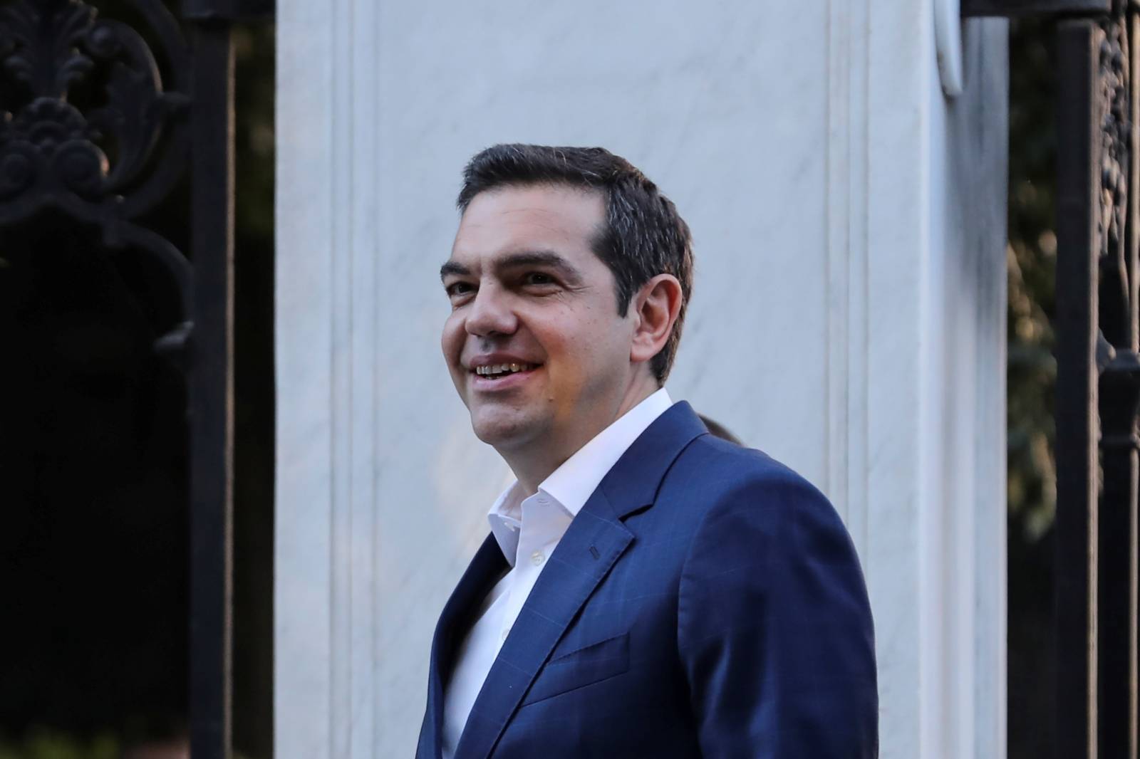 Greek PM Tsipras leaves the Presidential Palace following a meeting with Greek President Pavlopoulos to discuss snap elections in Athens