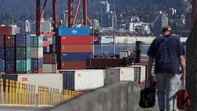 FILE PHOTO: Pacific dock workers return to clear a backlog of containers and bulk cargo at the Port of Vancouver