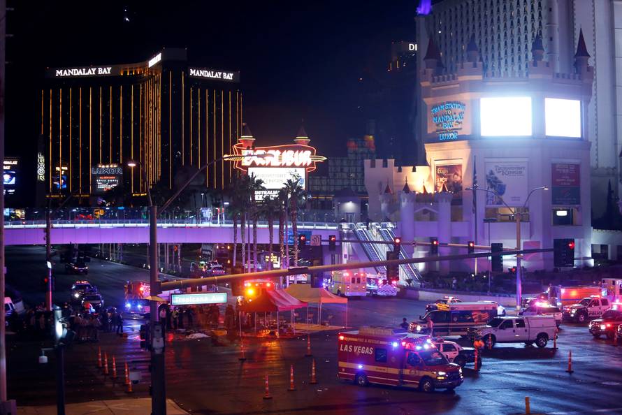 Las Vegas Metro Police and medical workers stage in the intersection of Tropicana Avenue and Las Vegas Boulevard South after a mass shooting at a music festival on the Las Vegas Strip in Las Vegas
