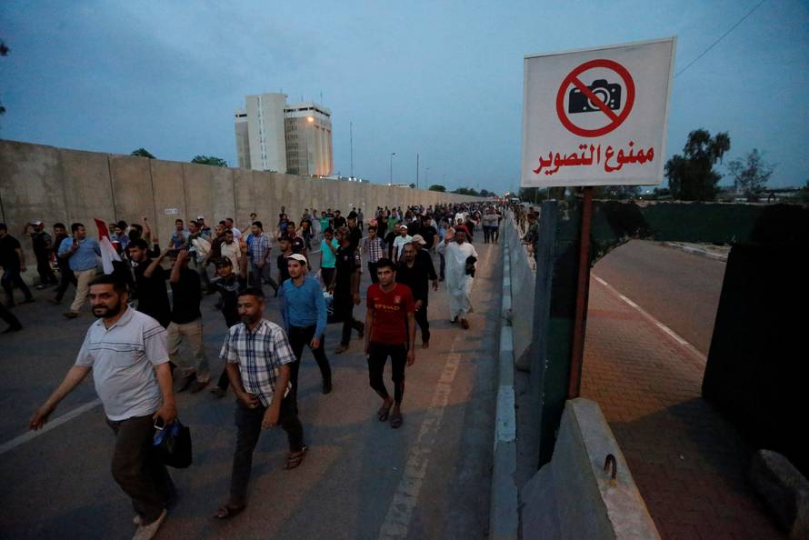 Followers of Iraqi Shi'ite cleric Moqtada al-Sadr leave the Green Zone in Baghdad