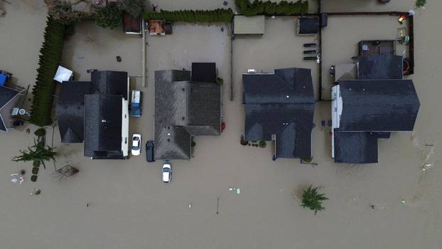 Floodwaters trigger evacuations and highway closures in British Columbia’s Fraser Valley