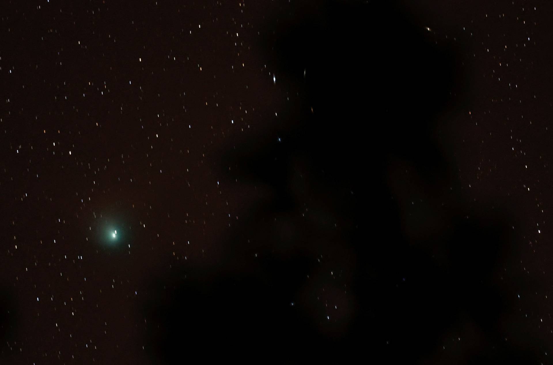 A green comet named Comet C/2022 E3 (ZTF), which last passed by our planet about 50,000 years ago is seen from the Pico de las Nieves