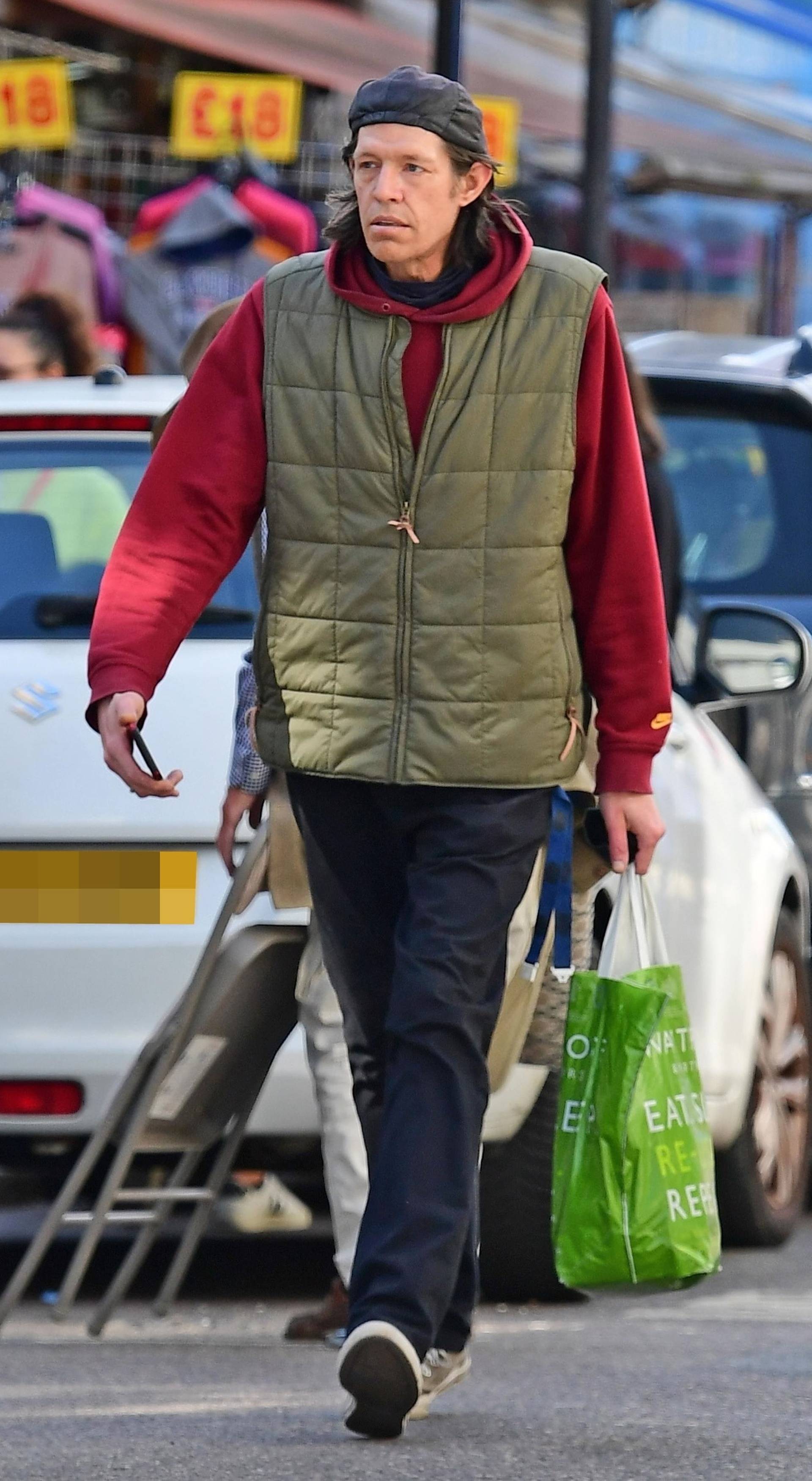 *EXCLUSIVE* Christopher Brosnan is spotted on a stroll holding his Waitrose bag out shopping on the Portobello Road in London's Notting Hill.