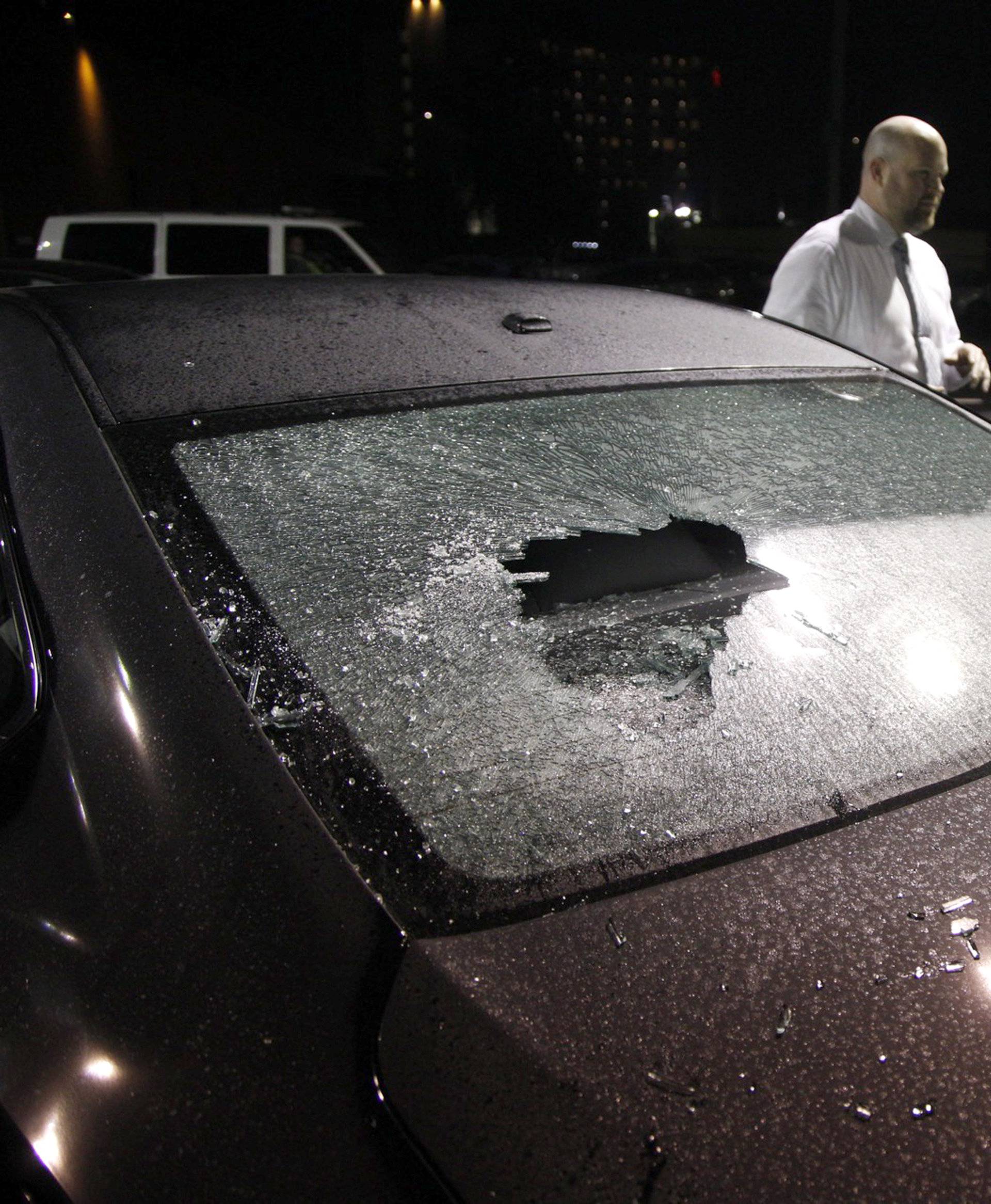 Damaged cars sit on a lot after a riot swept through the area in protest to the election of Republican Donald Trump as President of the United States in Portland