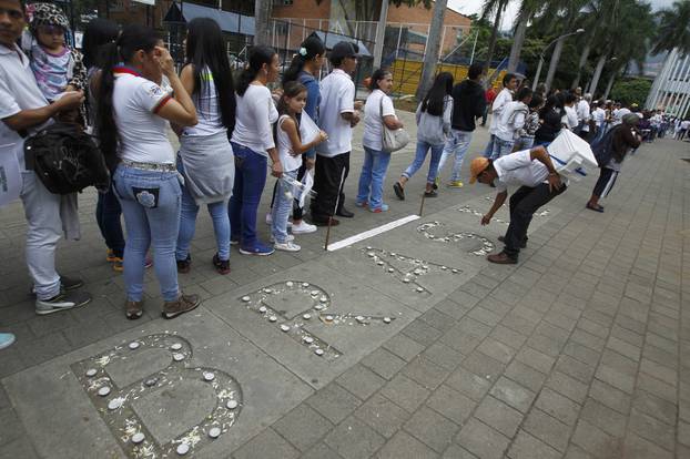 Fans of Atletico Nacional soccer club pay tribute to the players of Brazilian club Chapecoense killed in the recent airplane crash in Medellin