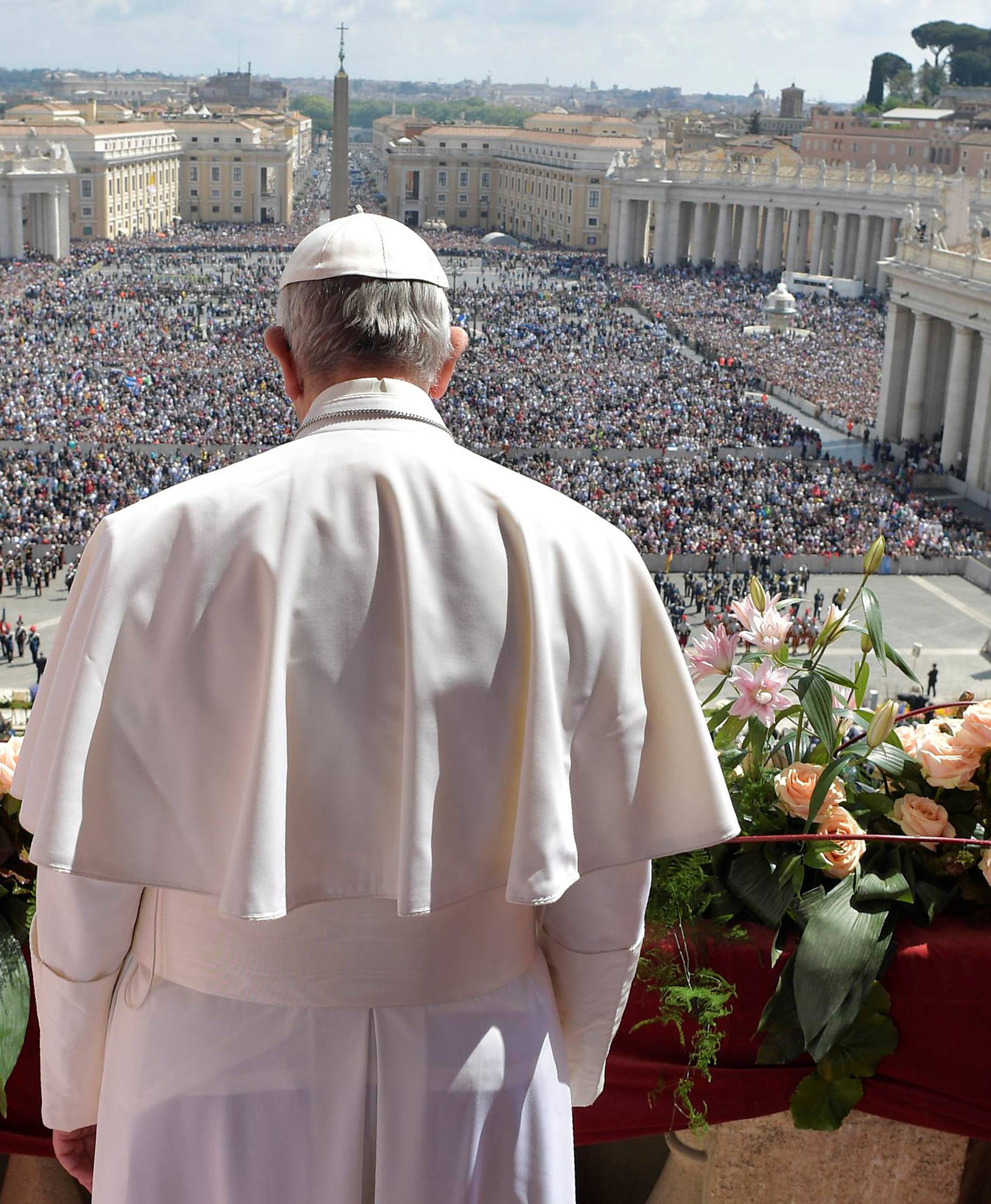 Pope Francis delivers his "Urbi et Orbi" (to the city and the world) message from the balcony overlooking St. Peter's Square at the Vatican