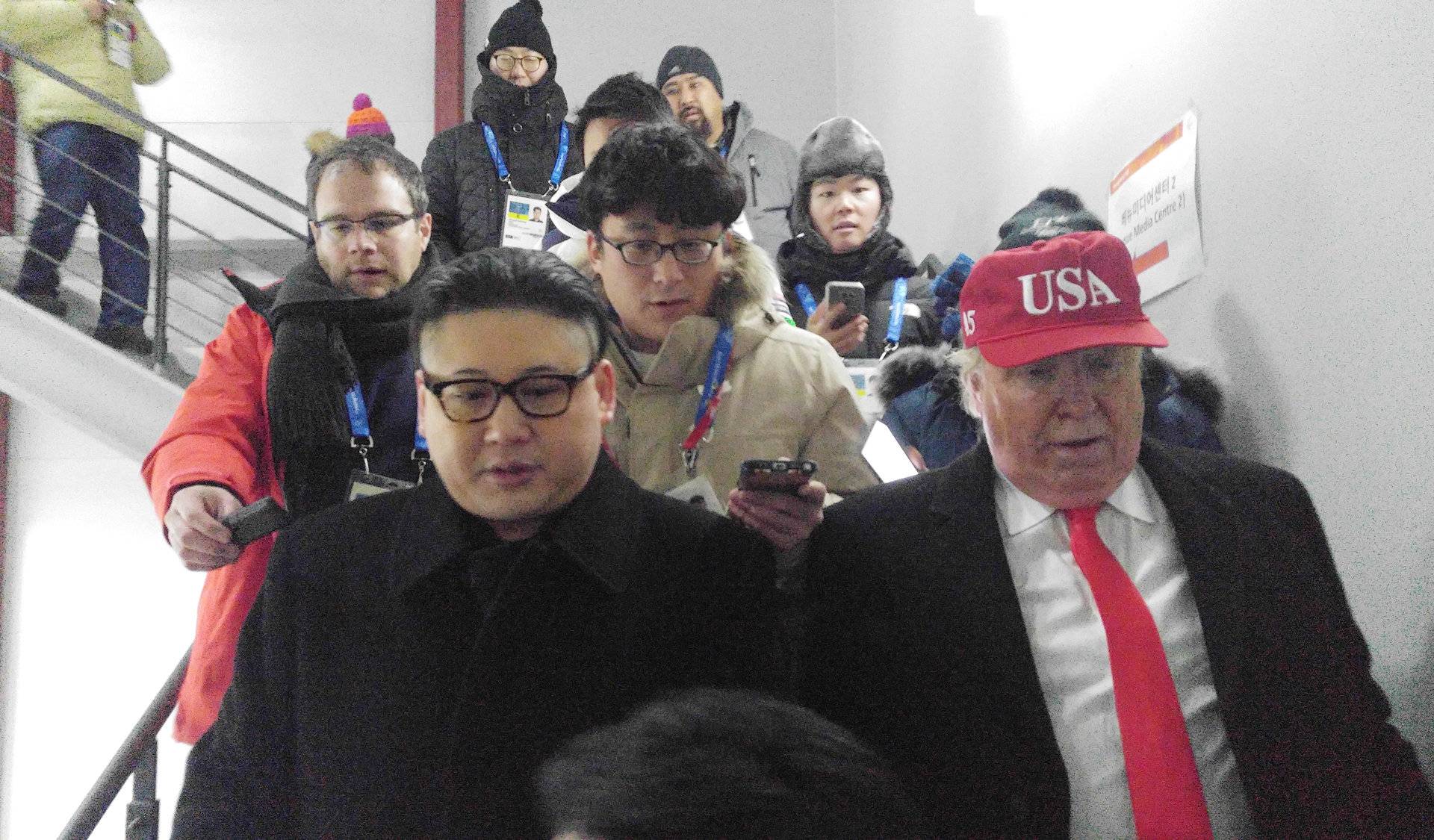 People dressed-up as U.S. President Donald Trump and North Korean leader Kim Jong Un attend the Winter Olympics opening ceremony in Pyeongchang