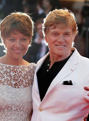 FILE PHOTO: Director Redford and wife Sibylle pose on red carpet during screening for movie "The Company You Keep" at 69th Venice Film Festival