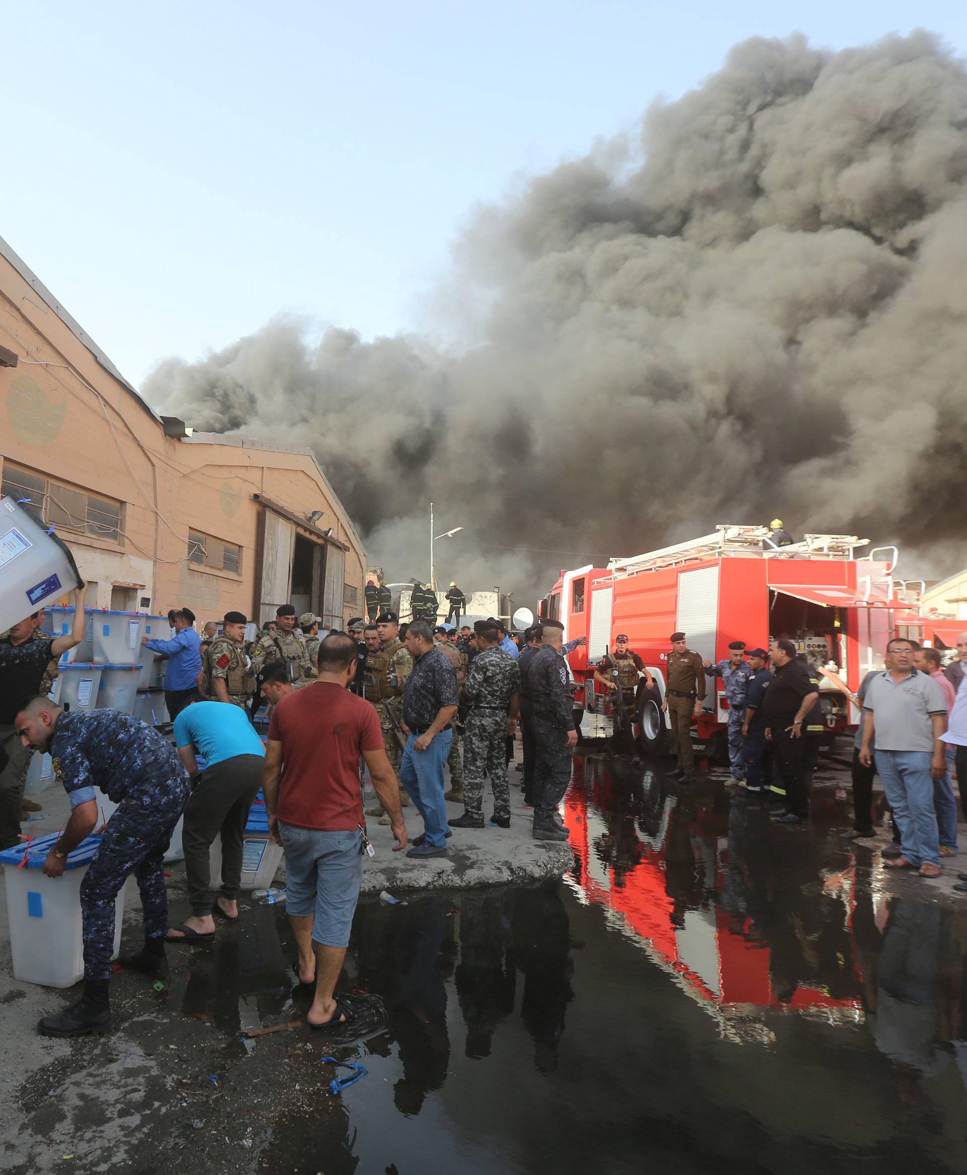 Smoke rises from a storage site in Baghdad, housing ballot boxes from Iraq's May parliamentary election