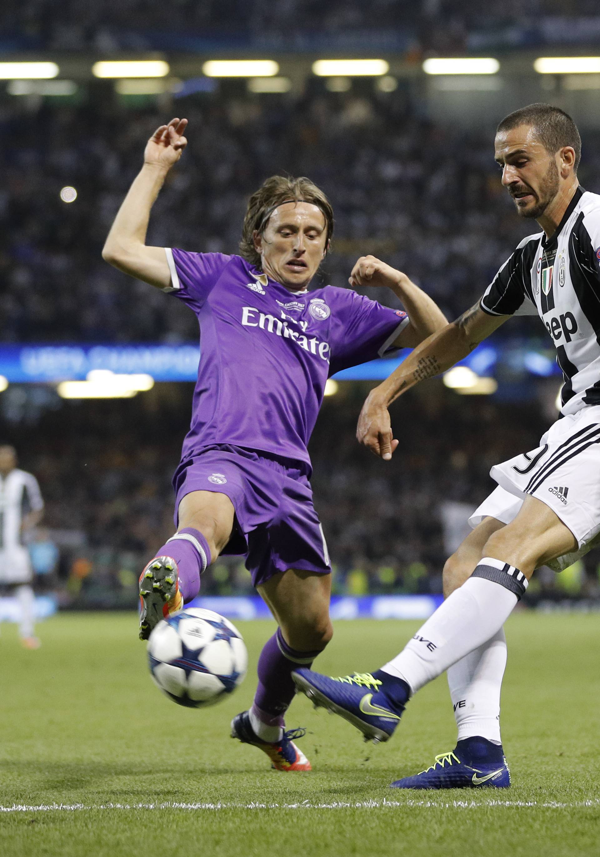 Juventus' Leonardo Bonucci in action with Real Madrid's Luka Modric