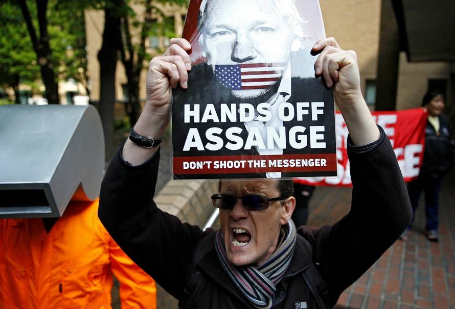 People protest outside Southwark Crown Court where WikiLeaks founder Julian Assange will be sentenced, in London