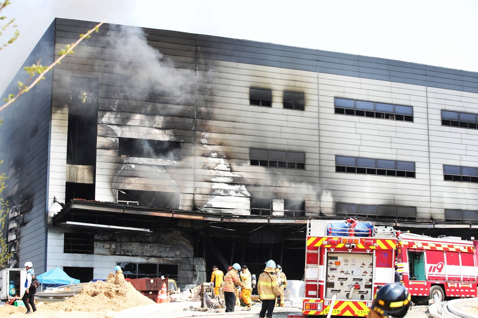 Smoke rises from a warehouse which is currently under construction, after it caught fire, in Icheon
