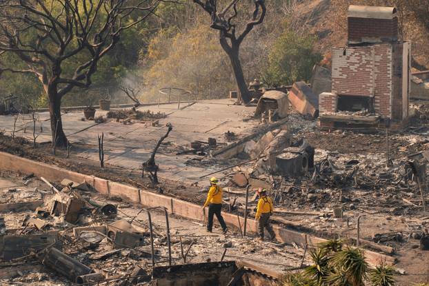 The remains of homes following the Palisades Fire in the Pacific Palisades neighborhood in Los Angeles