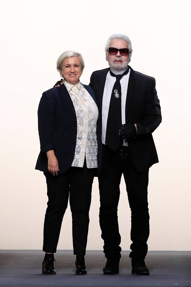 Designers Karl Lagerfeld and Silvia Venturini appears at the end of their Haute Couture Fall/Winter 2018/2019 collection show for fashion house Fendi in Paris