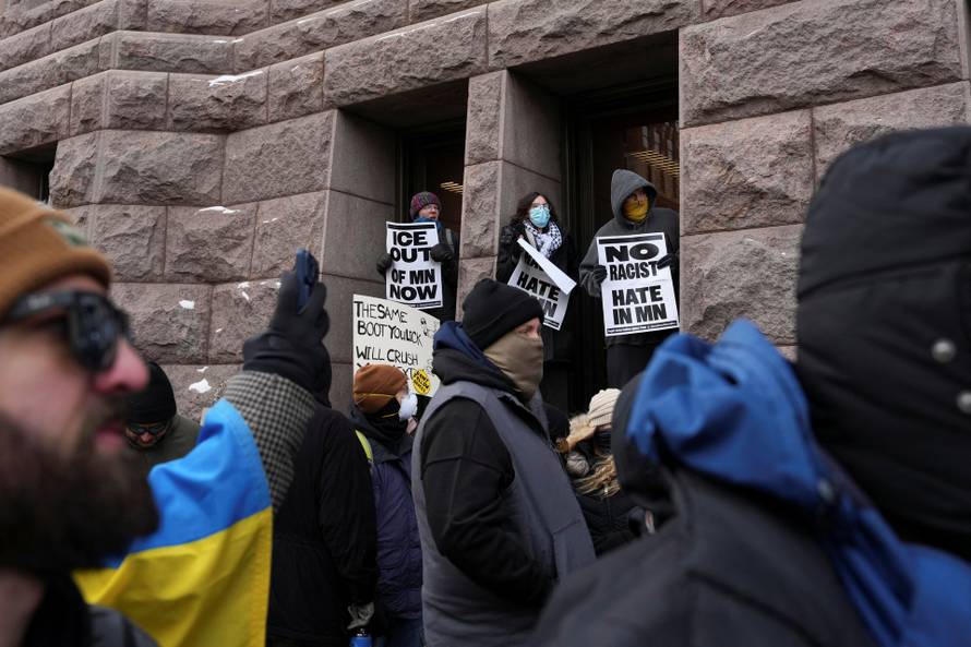 People attend the "March Against Minnesota Fraud" in Minneapolis